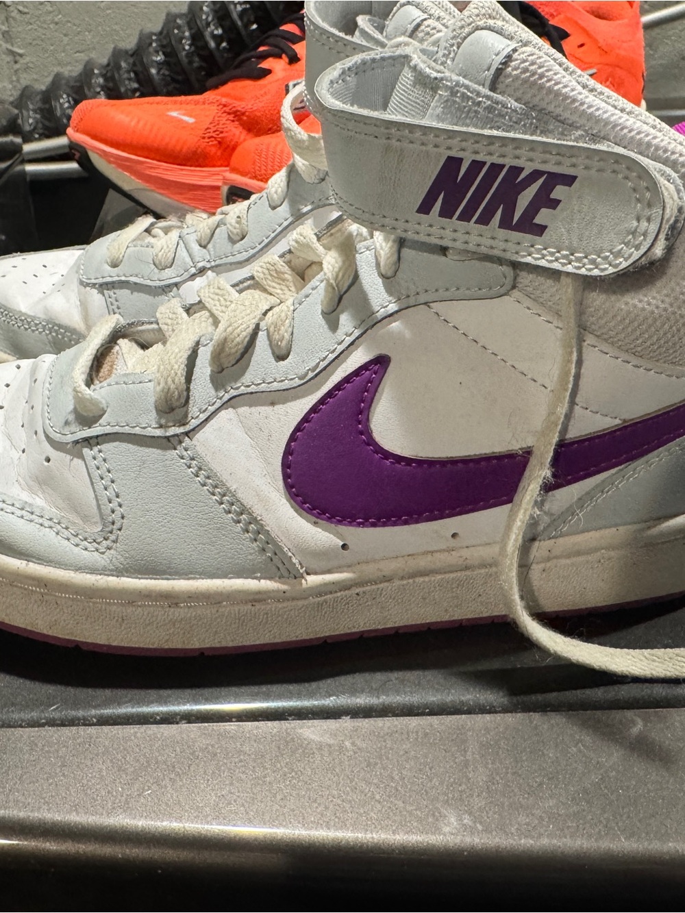Nike White High-Top Sneakers with Purple Swoosh